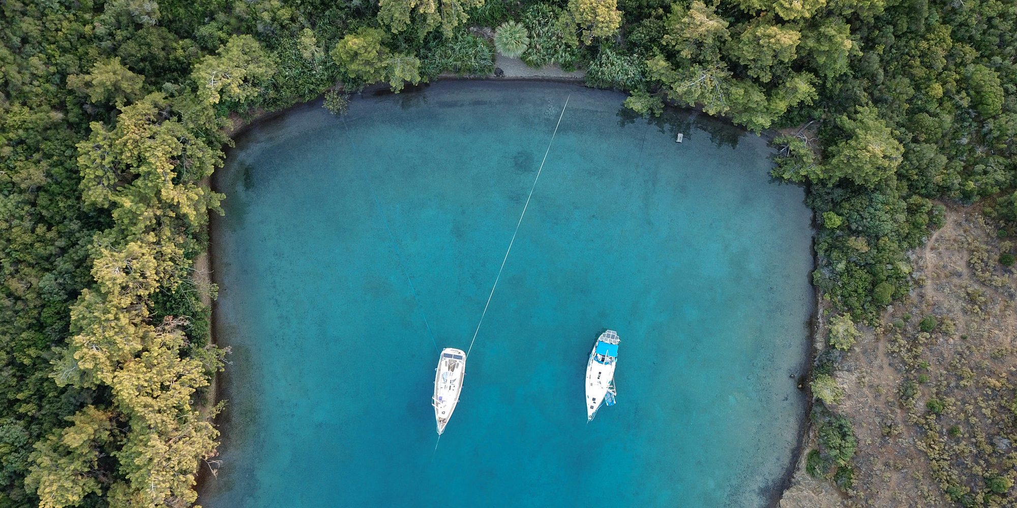 Boats in azure water in the Aegean region of Turkey.jpg